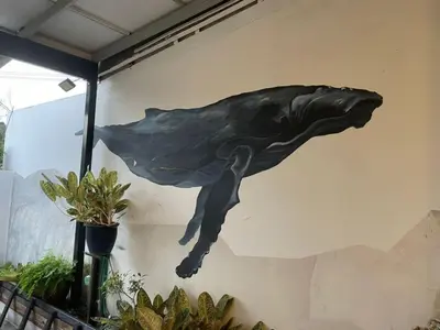 a painting of a dolphin on the side of a wall at Unique Design House, 2BR House - Near Ipoh Local Foodies in Ipoh