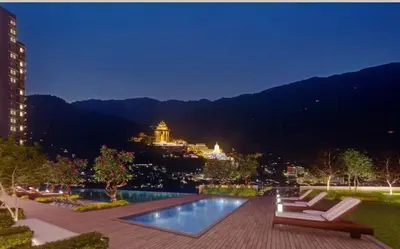 a view of a city at night with a swimming pool at Studio 2bed4pax KekLokSi View in Ayer Itam