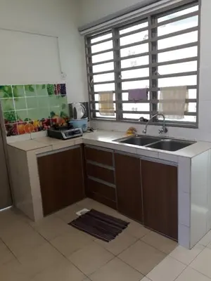 a kitchen with a sink and a window at Camlodge apartments in Tanah Rata
