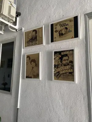 a group of pictures on a wall at Sammy Hoomestay Ipoh in Ipoh