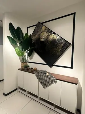 a cabinet with a potted plant on top of it at Sunway Onsen Suites in Tambun
