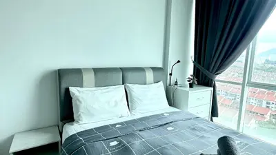 a bedroom with a bed and a large window at 2BR Lively City View Family Suite#Airport in Bayan Lepas