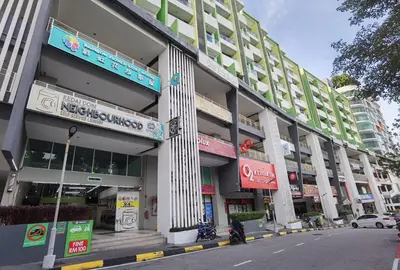 a large building on a city street with a street at 2BR Lively City View Family Suite#Airport in Bayan Lepas