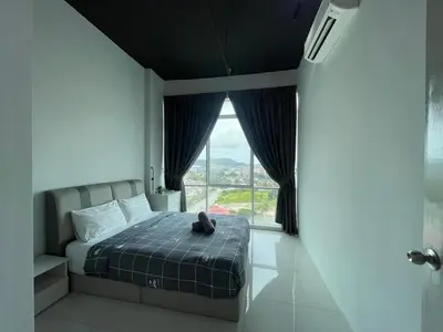a bedroom with a bed and a large window at 2BR Airport Panoramic View Family Suite in Bayan Lepas