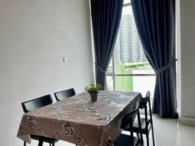 a dining room table with chairs and a large window at 2BR Airport Panoramic View Family Suite in Bayan Lepas