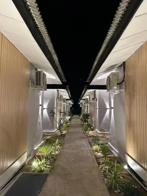 an empty hallway in a building with a dark ceiling at Alva Boutique Chalet Pangkor in Pangkor
