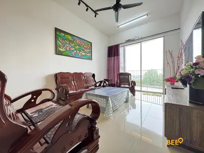 a living room with chairs and a table and a window at Taiping Crystal Creek Condo Pool Gym Netflix in Taiping