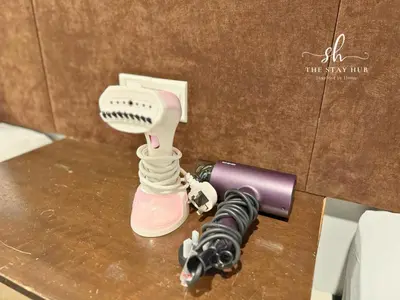 a hair dryer sitting on a table next to a microphone at Seaview Maritime Suites, Penang George Town, Karpal Singh Drive-Free Parking by The Stay Hub in George Town