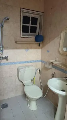 a bathroom with a toilet and a sink at Cool view budget hotel in Cameron Highlands