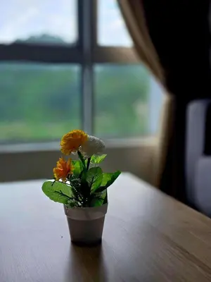 a small flower pot sitting on top of a table at b08 The Anderson Ipoh Family Stay 2BR in Ipoh