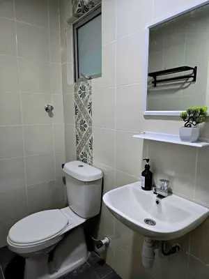 a bathroom with a toilet and a sink at b08 The Anderson Ipoh Family Stay 2BR in Ipoh