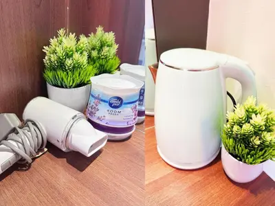 two pictures of flowers in cups on a table at Pangkor Island Pool View Studio 2 Queen Beds 2 Min Walk to the Beach Free WiFi & Parking in Pangkor