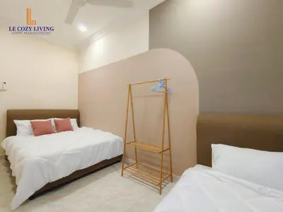a bedroom with a bed and a ladder in it at The Cozy Retreat House at Bukit Mertajam in Bukit Mertajam