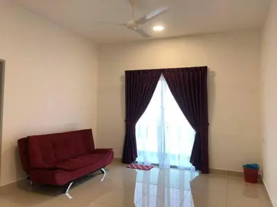 a living room with a red chair and a window at TK Homie in Tanjung Karang