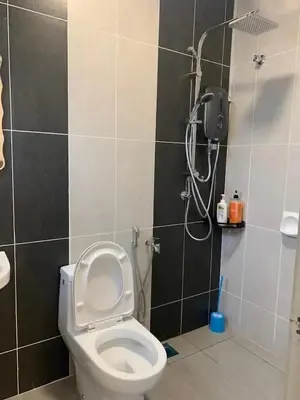 a bathroom with a toilet and a shower at TK Homie in Tanjung Karang