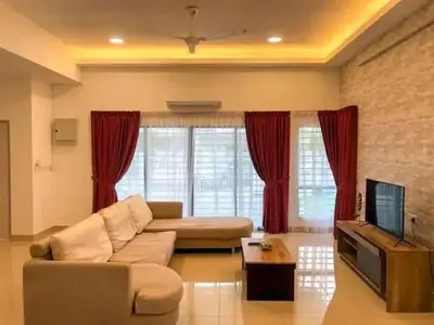 a living room with a couch and a tv at TK Homie in Tanjung Karang