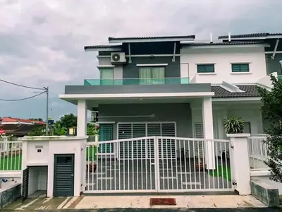 a house with a white fence in front of it at TK Homie in Tanjung Karang