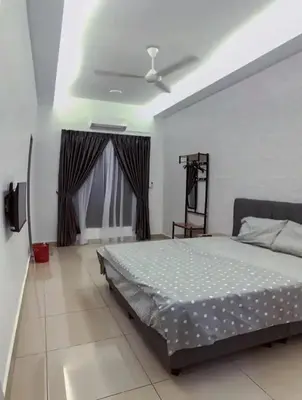 a bedroom with a bed and a ceiling fan at TK Homie in Tanjung Karang