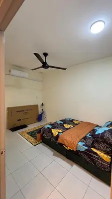 a bedroom with a bed and a ceiling fan at Homestay Tapah by homestay uitm tapah in Tapah Road