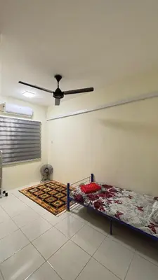 a room with two beds and a ceiling fan at Homestay Tapah by homestay uitm tapah in Tapah Road