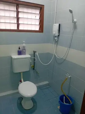 a bathroom with a toilet and a shower at Tambun Lastworld Sapari Homestay in Tambun