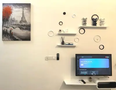 a desk with a computer on a wall with shelves at Summer Cozy Studio Room in Perai