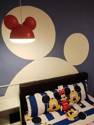 a bedroom with a bed with stuffed animals on it at Elephant House Hotel in George Town
