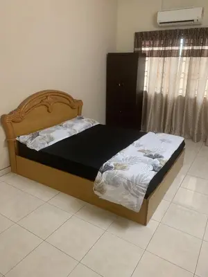 a bed sitting in a room with at TD Homestay in Ipoh