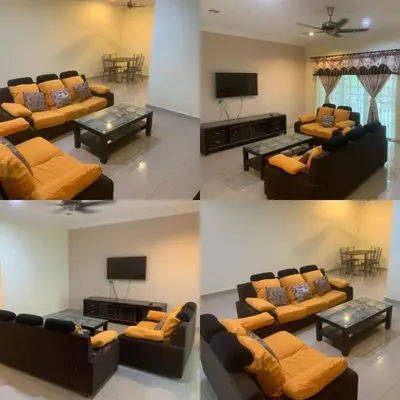 four pictures of a living room with couches and a television at TD Homestay in Ipoh