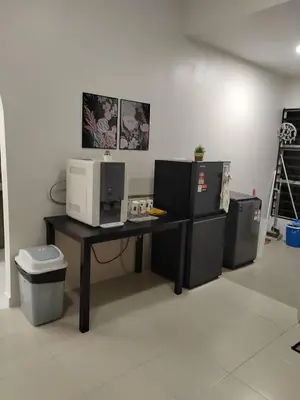 a office with a desk with a computer on it at Ana Homestay in Seri Manjung