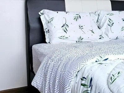 a bedroom with a bed with white sheets and pillows at 8\u697c\u6c11\u5bbf Enjoy the Paddy Field View in Sekincan
