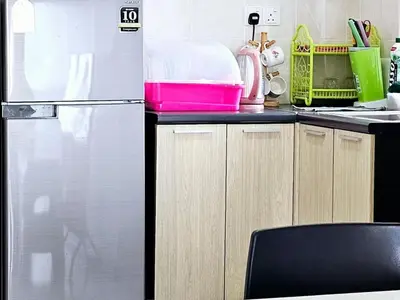 a kitchen with a refrigerator and a counter top at 8\u697c\u6c11\u5bbf Enjoy the Paddy Field View in Sekincan