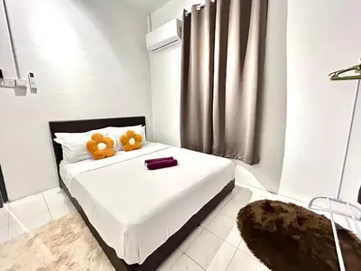 a bedroom with a bed with two teddy bears on it at CozySukun40#6pax#Netflix#NearIconCity#BukitMertajam in Bukit Mertajam