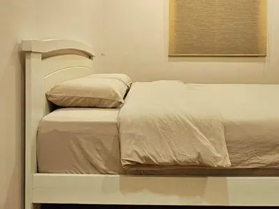 two beds in a white room with at \u65e5\u5f0f10\u697c7\u53f7 Comfy Japanese Style Unblocked Paddy View in Sekincan