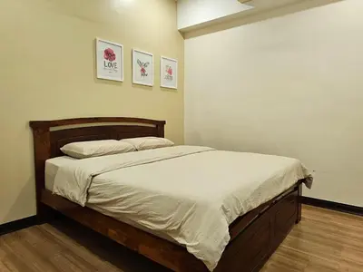a bedroom with a large bed with white sheets at \u65e5\u5f0f10\u697c7\u53f7 Comfy Japanese Style Unblocked Paddy View in Sekincan