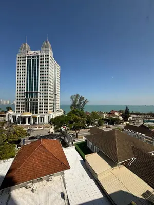 a view of a tall white building with a city at Hotel Regal Malaysia in George Town