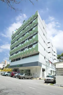 a large building with cars parked in front of it at Hotel Regal Malaysia in George Town