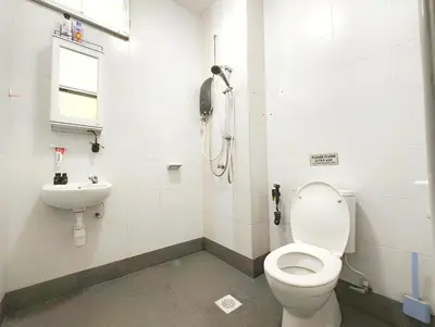 a bathroom with a toilet and a sink at Premium Homestay - Tol Taiping in Kamunting