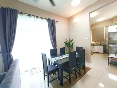 a dining room with a table and chairs at Premium Homestay - Tol Taiping in Kamunting