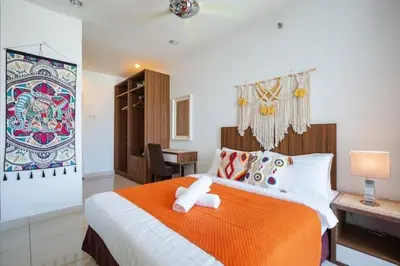 a bedroom with a bed with a teddy bear on it at Georgetown Mansion One Apartment by Jere Penang Gleneagles Gurney in George Town