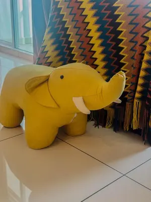 a yellow elephant toy sitting on the floor at Georgetown Mansion One Apartment by Jere Penang Gleneagles Gurney in George Town