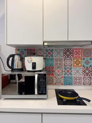 a kitchen with a microwave on a counter at Georgetown Mansion One Apartment by Jere Penang Gleneagles Gurney in George Town