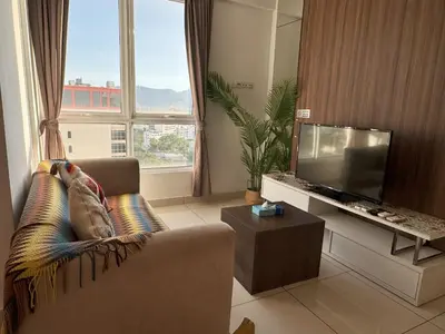 a living room with a couch and a flat screen tv at Georgetown Mansion One Apartment by Jere Penang Gleneagles Gurney in George Town