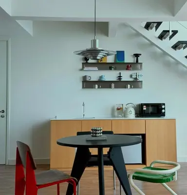 a dining room with a table and chairs at Maritime Suite Haus - Penang Top Sea View in Jelutong