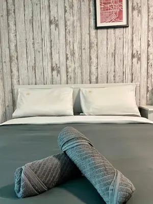 a bed with a pillow laying on the floor at Maritime Suite Haus - Penang Top Sea View in Jelutong