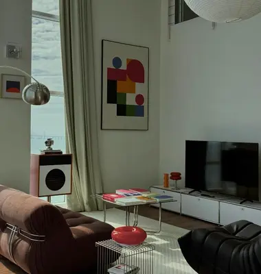 a living room with a couch and a tv at Maritime Suite Haus - Penang Top Sea View in Jelutong