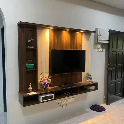 a television on a wall in a room at Darainhomestay in Gua Sai