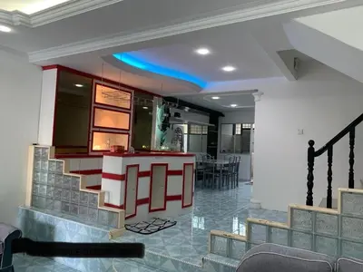 a kitchen with a bar in a house at Thind place in Kamunting