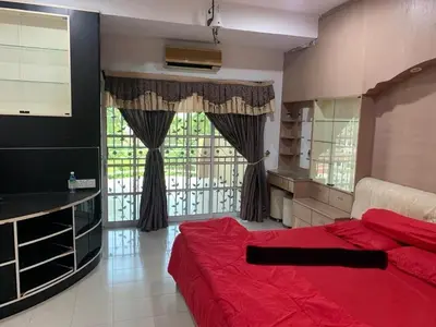 a bedroom with a red bed and a large window at Thind place in Kamunting