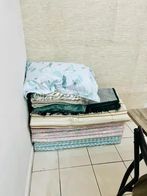 three pillows are stacked on top of each other at Teha Homestay Botani in Ipoh